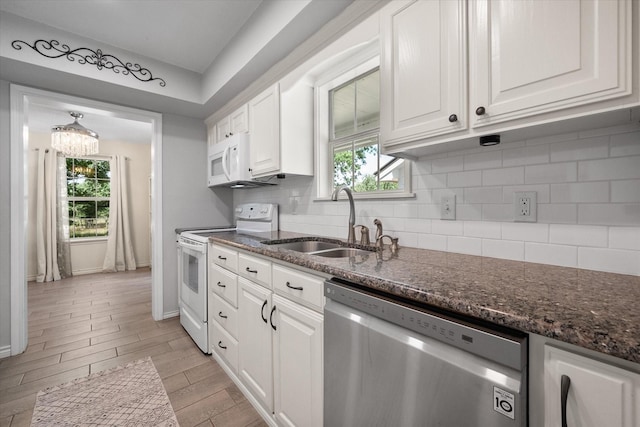 7720 Angelina Dr, Athens, TX 75752 - kitchen with white appliances, white cabinets, tasteful backsplash, and dark stone counters