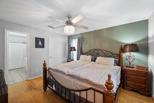 7720 Angelina Dr, Athens, TX 75752 - bedroom featuring hardwood / wood-style floors, a ceiling fan, and ensuite bath