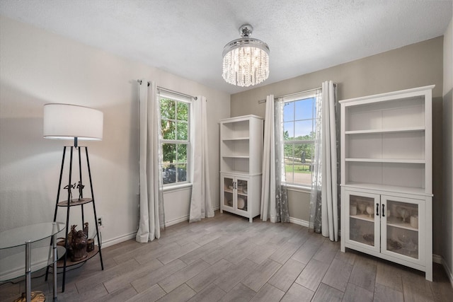 7720 Angelina Dr, Athens, TX 75752 - unfurnished dining area featuring a chandelier and wood finished floors