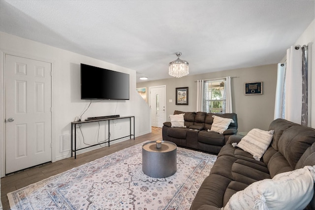 7720 Angelina Dr, Athens, TX 75752 - living area with a chandelier and wood finished floors