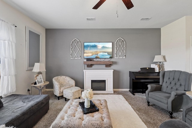 197 Point Rider Rd, Newark, TX 76071 - carpeted living room featuring a ceiling fan and a glass covered fireplace