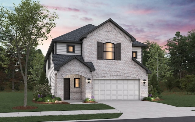 469 Silent Pond, Lavon, TX 75166 - french country style house with concrete driveway, a garage, brick siding, roof with shingles, and a front lawn