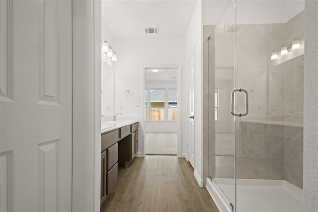 469 Silent Pond, Lavon, TX 75166 - full bath featuring double vanity, a shower stall, and wood finished floors