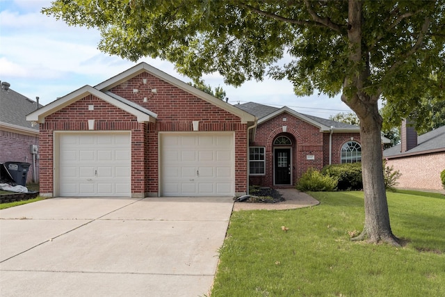 1647 Ash Ln, Corinth, TX 76210 - view of front of house featuring driveway, an attached garage, brick siding, and a front lawn