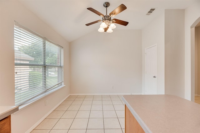 1647 Ash Ln, Corinth, TX 76210 - spare room with lofted ceiling, ceiling fan, and light tile patterned floors