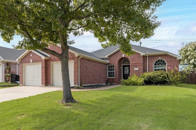 1647 Ash Ln, Corinth, TX 76210 - view of front of home featuring a garage, a front yard, brick siding, and driveway