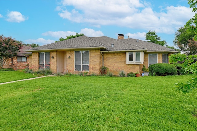 2217 Cedar Cir, Carrollton, TX 75006 - ranch-style house featuring a chimney, a front lawn, and brick siding