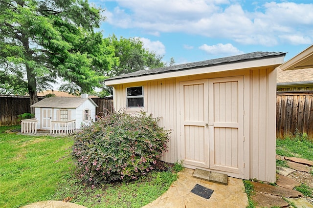 2217 Cedar Cir, Carrollton, TX 75006 - view of shed with a fenced backyard