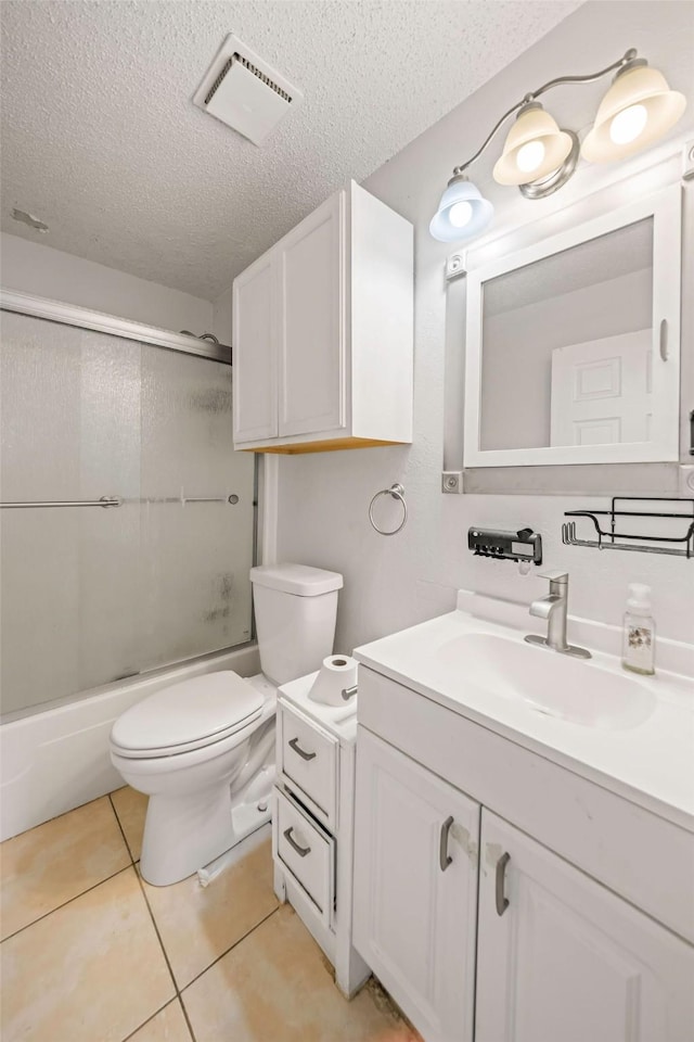 101 Arrowhead St, Fort Worth, TX 76108 - full bath with a textured ceiling, vanity, tile patterned flooring, and enclosed tub / shower combo