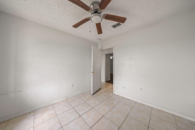101 Arrowhead St, Fort Worth, TX 76108 - empty room featuring a ceiling fan, a textured ceiling, and light tile patterned floors