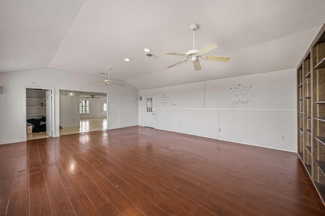 101 Arrowhead St, Fort Worth, TX 76108 - unfurnished living room featuring ceiling fan, lofted ceiling, wood finished floors, and a textured ceiling