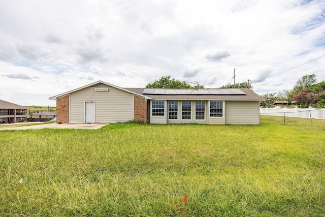 101 Arrowhead St, Fort Worth, TX 76108 - rear view of property featuring roof mounted solar panels and brick siding