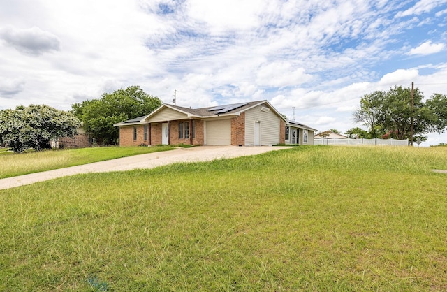 101 Arrowhead St, Fort Worth, TX 76108 - ranch-style home featuring driveway, an attached garage, solar panels, and brick siding