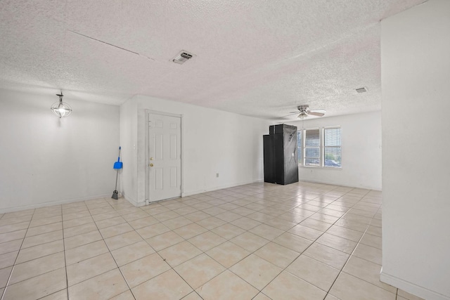 101 Arrowhead St, Fort Worth, TX 76108 - spare room featuring a textured ceiling, a ceiling fan, and light tile patterned flooring