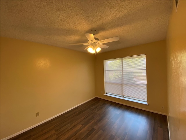 376 Valley Park Dr, Garland, TX 75043 - spare room with dark wood-style flooring, ceiling fan, and a textured ceiling