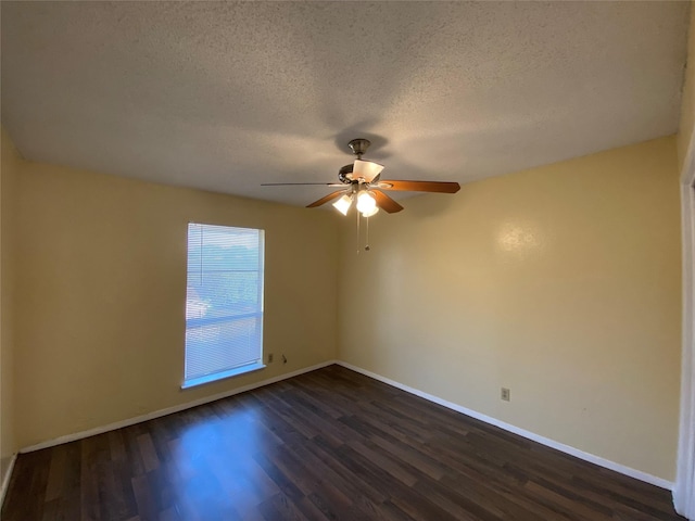 376 Valley Park Dr, Garland, TX 75043 - spare room with a textured ceiling, dark wood-style floors, and ceiling fan