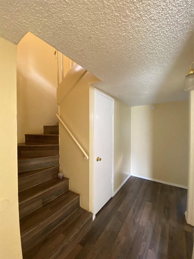 376 Valley Park Dr, Garland, TX 75043 - stairs featuring wood finished floors and a textured ceiling