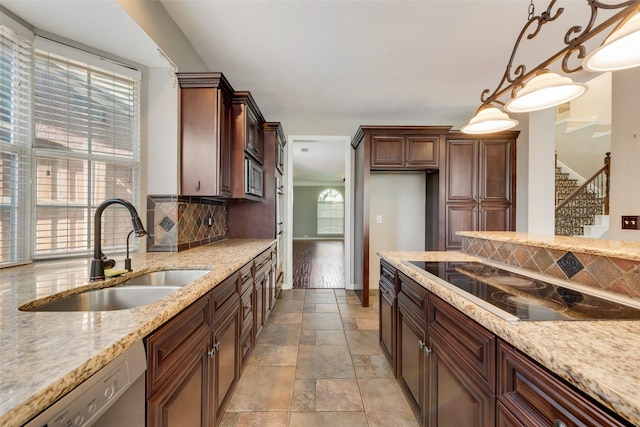 4105 Williams Ct, Grapevine, TX 76051 - kitchen featuring stainless steel appliances, tasteful backsplash, light stone finish floors, light stone countertops, and pendant lighting