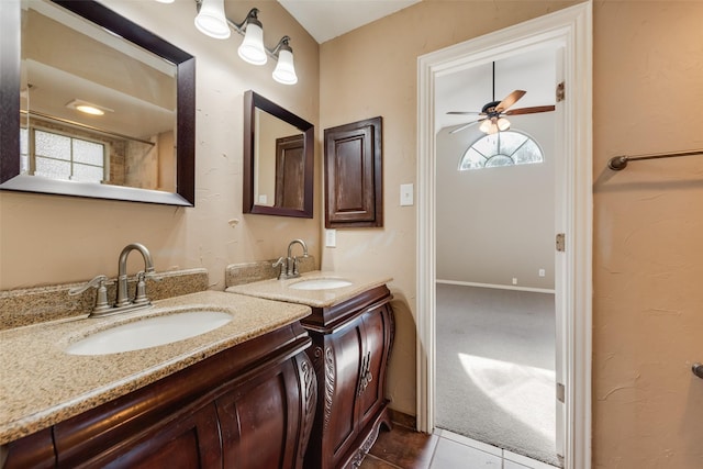 4105 Williams Ct, Grapevine, TX 76051 - bathroom with two vanities, a ceiling fan, and tile patterned floors