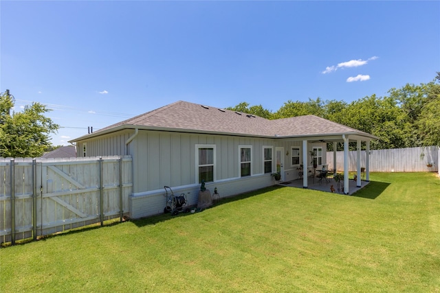 5523 Firewood Trl, Granbury, TX 76048 - rear view of house with roof with shingles, a patio area, a fenced backyard, board and batten siding, and ceiling fan