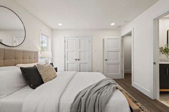 2727 Shelby Ave Unit O, Dallas, TX 75219 - bedroom with dark wood-style flooring, recessed lighting, and a closet