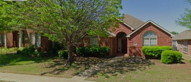 1646 Carson Ln, Frisco, TX 75033 - view of front of house with a front lawn and brick siding