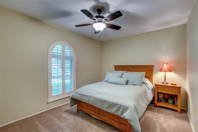 5610 Christie Ln, Garland, TX 75044 - carpeted bedroom featuring baseboards and ceiling fan