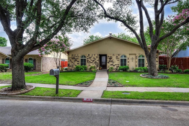 5610 Christie Ln, Garland, TX 75044 - view of front facade featuring brick siding