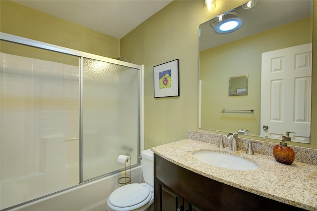 5610 Christie Ln, Garland, TX 75044 - bathroom featuring vanity and bath / shower combo with glass door