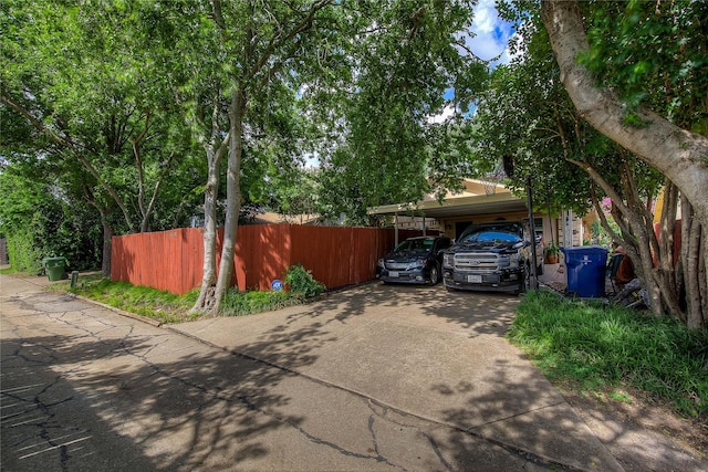 5610 Christie Ln, Garland, TX 75044 - view of home's exterior featuring driveway and a carport
