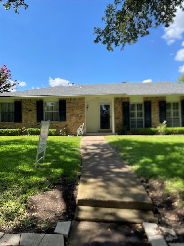 1505 Windy Meadow Dr, Plano, TX 75023 - single story home with a front yard and brick siding