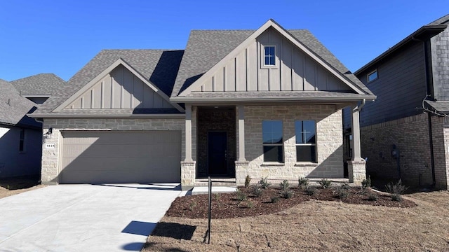 1821 Brindle St, Northlake, TX 76247 - view of front facade with board and batten siding, stone siding, a shingled roof, and concrete driveway