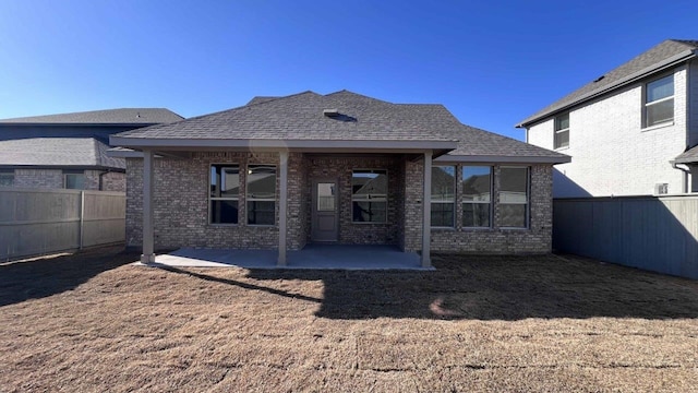 1821 Brindle St, Northlake, TX 76247 - rear view of property featuring a fenced backyard, a patio, and roof with shingles