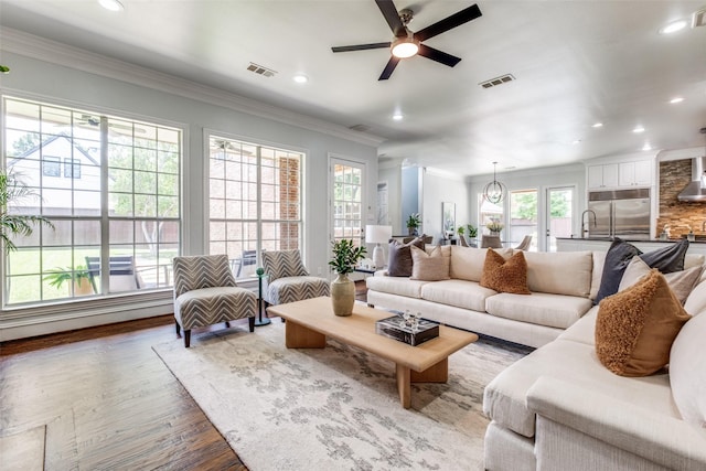 4421 Caruth Blvd, Dallas, TX 75225 - living area with ceiling fan, wood finished floors, recessed lighting, and crown molding