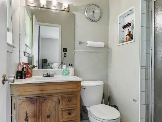 2407 Towerwood Dr, Carrollton, TX 75006 - bathroom featuring vanity and a shower with door