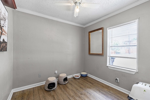 6301 Shadydell Dr, Fort Worth, TX 76135 - spare room featuring a textured ceiling, wood finished floors, a ceiling fan, and ornamental molding