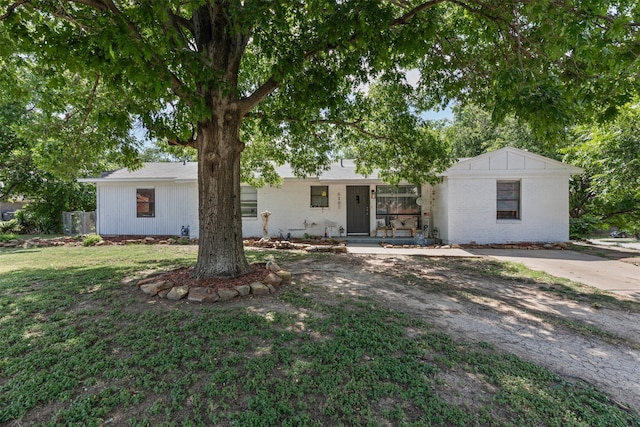6301 Shadydell Dr, Fort Worth, TX 76135 - view of front of house featuring a porch, a front lawn, and brick siding