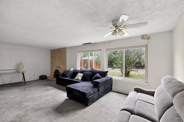 1801 Plantation Rd, Garland, TX 75044 - living area featuring light colored carpet, a textured ceiling, and ceiling fan