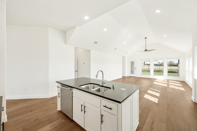 2500 Fischer Ln, Mansfield, TX 76063 - kitchen with stainless steel dishwasher, dark countertops, light wood-type flooring, ceiling fan, and vaulted ceiling