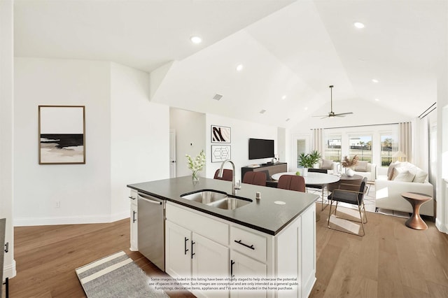 2500 Fischer Ln, Mansfield, TX 76063 - kitchen with dishwasher, dark countertops, a ceiling fan, vaulted ceiling, and light wood-type flooring