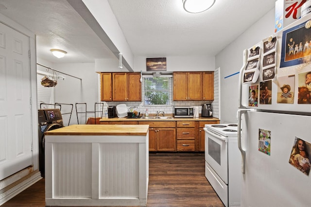 1601 W Bond St, Denison, TX 75020 - kitchen with white appliances, brown cabinets, dark wood-style flooring, wooden counters, and tasteful backsplash