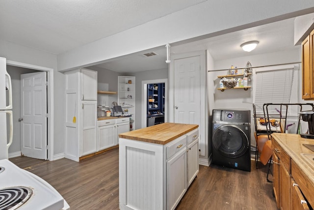 1601 W Bond St, Denison, TX 75020 - kitchen featuring wood counters, washer / clothes dryer, dark wood-style floors, white cabinetry, and open shelves