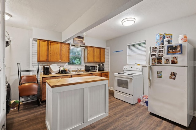 1601 W Bond St, Denison, TX 75020 - kitchen featuring white appliances, wooden counters, dark wood-style floors, and backsplash