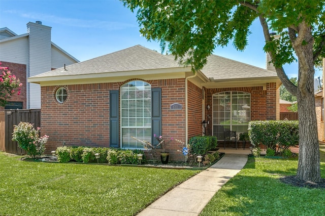 661 Raintree Cir, Coppell, TX 75019 - view of front of house featuring brick siding and roof with shingles