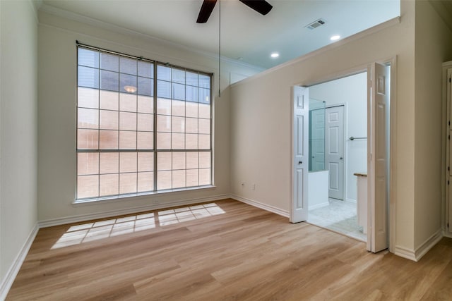 661 Raintree Cir, Coppell, TX 75019 - empty room featuring crown molding, a ceiling fan, plenty of natural light, and light wood finished floors