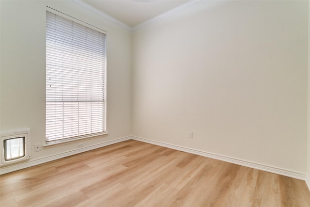661 Raintree Cir, Coppell, TX 75019 - empty room featuring light wood-style floors and crown molding