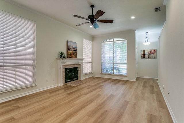 661 Raintree Cir, Coppell, TX 75019 - unfurnished living room featuring light wood-style floors, a fireplace with flush hearth, ornamental molding, ceiling fan, and recessed lighting