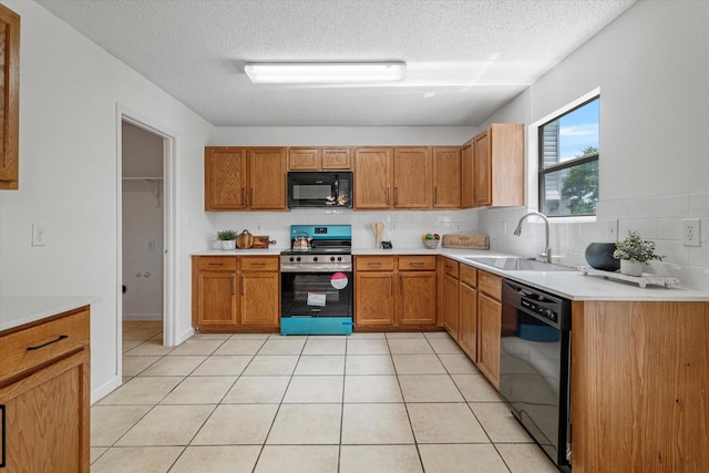 3300 Jacobs Dr, Mckinney, TX 75070 - kitchen featuring black appliances, decorative backsplash, a textured ceiling, light countertops, and brown cabinetry