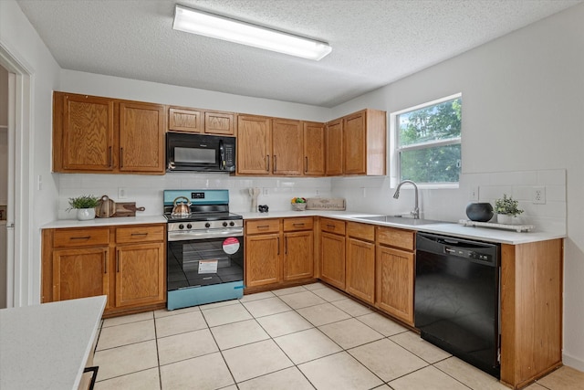 3300 Jacobs Dr, Mckinney, TX 75070 - kitchen with black appliances, a textured ceiling, light countertops, backsplash, and brown cabinetry