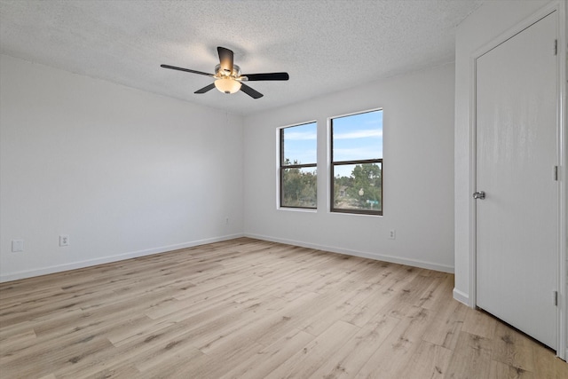 3300 Jacobs Dr, Mckinney, TX 75070 - unfurnished room featuring light wood-type flooring, a textured ceiling, and ceiling fan